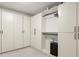 Large walk-in closet with custom shelving, lots of storage, and locking safe at 5925 Pine Bluff Dr, Cumming, GA 30040