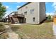 Back of home featuring a wood deck, walk out basement and rock lined border at 5925 Pine Bluff Dr, Cumming, GA 30040