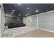 Luxurious home theater with custom wall design, plush seating, and ambient lighting at 5925 Pine Bluff Dr, Cumming, GA 30040