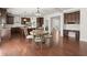 Open kitchen and dining area featuring wooden cabinets and modern appliances at 5925 Pine Bluff Dr, Cumming, GA 30040