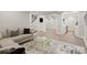 Spacious living room with stairs, TV, white columns, gray sofa, and a decorative rug at 5925 Pine Bluff Dr, Cumming, GA 30040