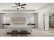 Relaxing main bedroom with a neutral palette, decorative headboard, and tray ceiling at 5925 Pine Bluff Dr, Cumming, GA 30040