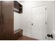 Convenient mudroom featuring custom storage cabinets and a bench at 5925 Pine Bluff Dr, Cumming, GA 30040