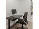 Home office space with a modern desk, chair, and fitness equipment at 5925 Pine Bluff Dr, Cumming, GA 30040
