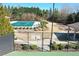 Community pool area with covered pool and nearby playground at 5925 Pine Bluff Dr, Cumming, GA 30040