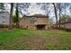 Home exterior featuring a deck, stairs to the yard, and a full walkout basement at 2611 Rock Point Ln, Snellville, GA 30039