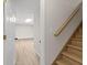 Stairway leading into the finished basement with sleek, wood-look floors at 2611 Rock Point Ln, Snellville, GA 30039