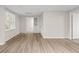 Finished basement with light wood-look floors and access to other rooms at 2611 Rock Point Ln, Snellville, GA 30039