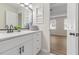Modern bathroom featuring a quartz countertop and access to a bedroom at 2611 Rock Point Ln, Snellville, GA 30039