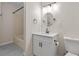 Cozy bathroom featuring a single sink vanity and a tub/shower combo at 2611 Rock Point Ln, Snellville, GA 30039