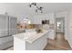 Modern kitchen features stainless steel appliances, granite countertops and white cabinets at 2611 Rock Point Ln, Snellville, GA 30039