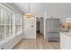 Eat-in kitchen features stainless steel appliances, ample natural light and white cabinets at 2611 Rock Point Ln, Snellville, GA 30039