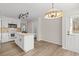 Bright kitchen features stainless steel appliances, granite countertops, white cabinets and eat-in space at 2611 Rock Point Ln, Snellville, GA 30039