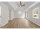 Spacious main bedroom featuring tray ceilings, ceiling fan, and light wood flooring at 2611 Rock Point Ln, Snellville, GA 30039