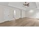 Spacious main bedroom featuring tray ceilings, ceiling fan, and light wood flooring at 2611 Rock Point Ln, Snellville, GA 30039
