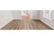Light-filled room showcasing new laminate flooring and fresh paint at 2611 Rock Point Ln, Snellville, GA 30039
