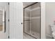 Shower featuring glass doors and tile surround at 2611 Rock Point Ln, Snellville, GA 30039