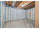Unfinished basement featuring exposed insulation, concrete floor, and visible utilities for a customizable space at 3330 Hillshire Dr, Cumming, GA 30028