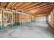 Unfinished basement with insulated walls, exposed ceiling beams, and poured concrete floors at 3330 Hillshire Dr, Cumming, GA 30028