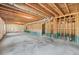 Unfinished basement featuring wood beams and insulation, ready for your personal touch and design at 3330 Hillshire Dr, Cumming, GA 30028