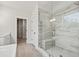 Modern bathroom featuring tiled shower, dual vanities, and large tub at 3330 Hillshire Dr, Cumming, GA 30028