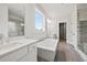 Serene bathroom with a soaking tub, tiled shower, and double sinks at 3330 Hillshire Dr, Cumming, GA 30028