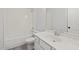 Bright bathroom with neutral walls, a white tub, and marble countertop at 3330 Hillshire Dr, Cumming, GA 30028