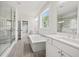 Spacious bathroom with a glass shower, soaking tub, and double vanity at 3330 Hillshire Dr, Cumming, GA 30028