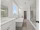 Elegant bathroom with a soaking tub, tiled shower, and dual vanities at 3330 Hillshire Dr, Cumming, GA 30028