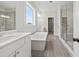 Luxury bathroom with double vanity, soaking tub, and glass-enclosed shower at 3330 Hillshire Dr, Cumming, GA 30028