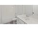 Elegant bathroom with a white vanity, sink, mirror, and tiled shower-tub combination at 3330 Hillshire Dr, Cumming, GA 30028