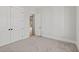 Neutral bedroom features carpet, and an ensuite door looking out to the house at 3330 Hillshire Dr, Cumming, GA 30028