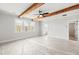Large bedroom with exposed beams, view to bath, and view to a hallway at 3330 Hillshire Dr, Cumming, GA 30028