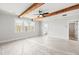 Well-lit bedroom with wood beam accents, a ceiling fan, and natural light at 3330 Hillshire Dr, Cumming, GA 30028