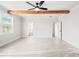 Spacious bedroom boasts exposed beams and views to bath and hall at 3330 Hillshire Dr, Cumming, GA 30028