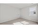 This bedroom features neutral walls, plush carpeting, and a window at 3330 Hillshire Dr, Cumming, GA 30028