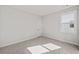 Bedroom with plush carpet, large window, and neutral color scheme at 3330 Hillshire Dr, Cumming, GA 30028