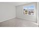 Bright bedroom with carpet, neutral walls, and a large window with a neighborhood view at 3330 Hillshire Dr, Cumming, GA 30028