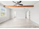 Large bedroom showcasing wood beams, ample space, and multiple doorways at 3330 Hillshire Dr, Cumming, GA 30028