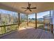 Covered wooden deck featuring a ceiling fan and views of the trees and surrounding landscape at 3330 Hillshire Dr, Cumming, GA 30028
