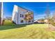 A bright two-story home with a white exterior, a well-manicured lawn, and a charming, covered wooden porch at 3330 Hillshire Dr, Cumming, GA 30028
