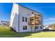 A bright two-story home with a white exterior, a well-manicured lawn, and a charming, covered wooden porch at 3330 Hillshire Dr, Cumming, GA 30028