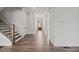 Foyer featuring wood-look floors and front door at 3330 Hillshire Dr, Cumming, GA 30028