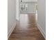 Inviting hallway with stylish wood flooring leading to a bright and airy living space at 3330 Hillshire Dr, Cumming, GA 30028