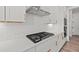 Modern white kitchen with stainless steel appliances, gas range, and white subway tile backsplash at 3330 Hillshire Dr, Cumming, GA 30028