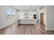 Bright, open kitchen with white cabinets, stainless steel appliances, and large island at 3330 Hillshire Dr, Cumming, GA 30028