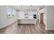 Modern kitchen featuring a large island, white cabinets, and stainless steel appliances at 3330 Hillshire Dr, Cumming, GA 30028