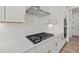 Modern kitchen features stainless steel appliances, white cabinetry and countertops, and subway tile backsplash at 3330 Hillshire Dr, Cumming, GA 30028