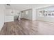Spacious living room with hardwood floors, large windows, and modern lighting fixtures at 3330 Hillshire Dr, Cumming, GA 30028