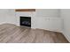 Living room with fireplace and built-ins featuring luxury vinyl plank flooring at 3330 Hillshire Dr, Cumming, GA 30028